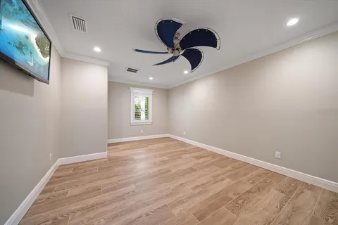 an aerial view of a house with a garden and lake view