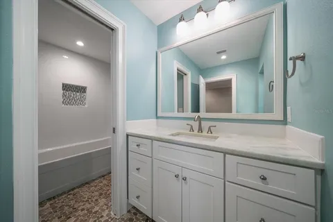 an aerial view of a house with outdoor space lake view and boat