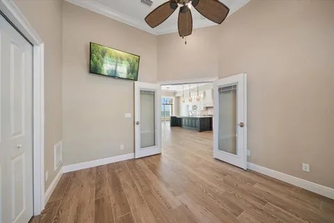 an aerial view of a house with garden space and sign board