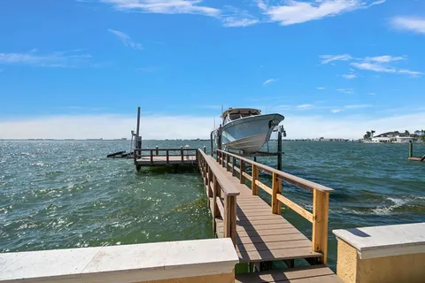 a view of a balcony with chairs