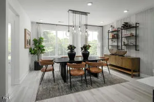 a dining room with furniture and window