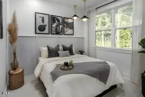 a bedroom with a bed and glass window