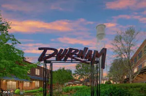 a view of a street with a building in the background