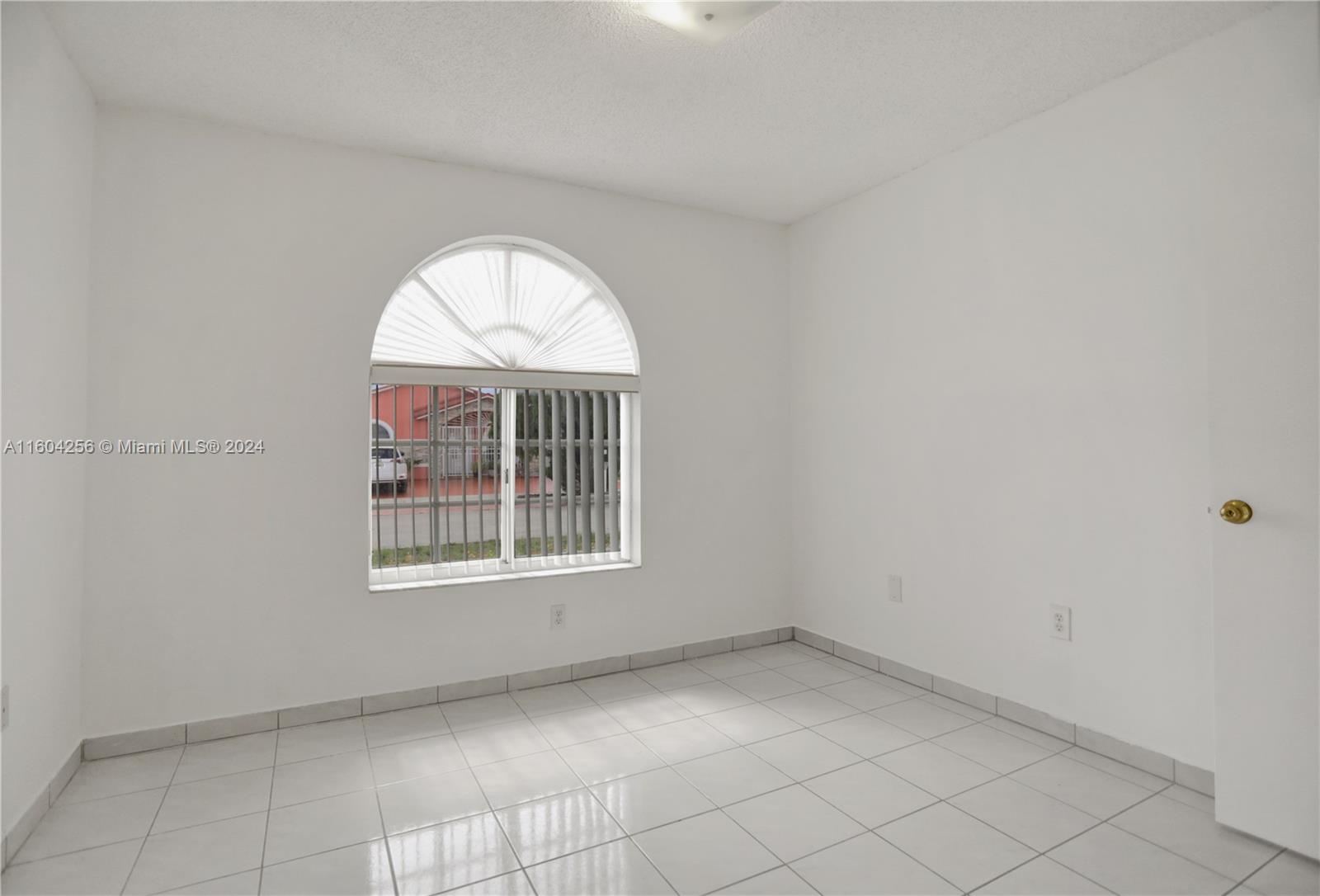 3131 West 79th Place Hialeah, FL 33018 - Photo 21 of 38 an empty room with windows