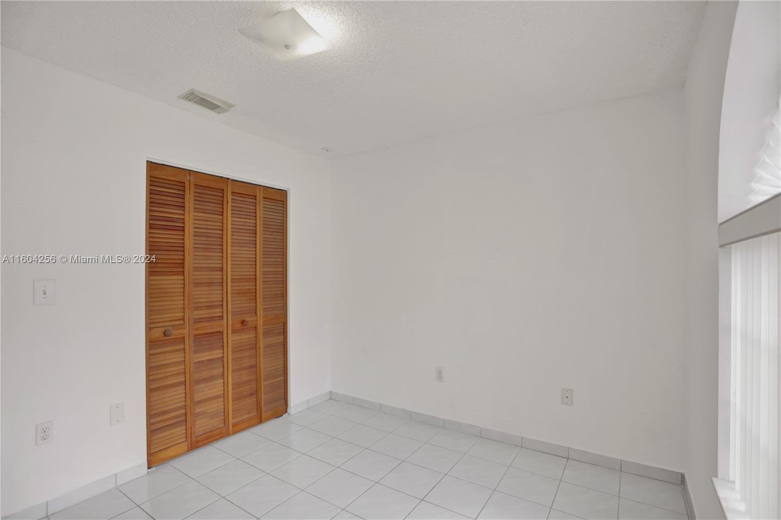 3131 West 79th Place Hialeah, FL 33018 - Photo 23 of 38 wooden floor in an empty room