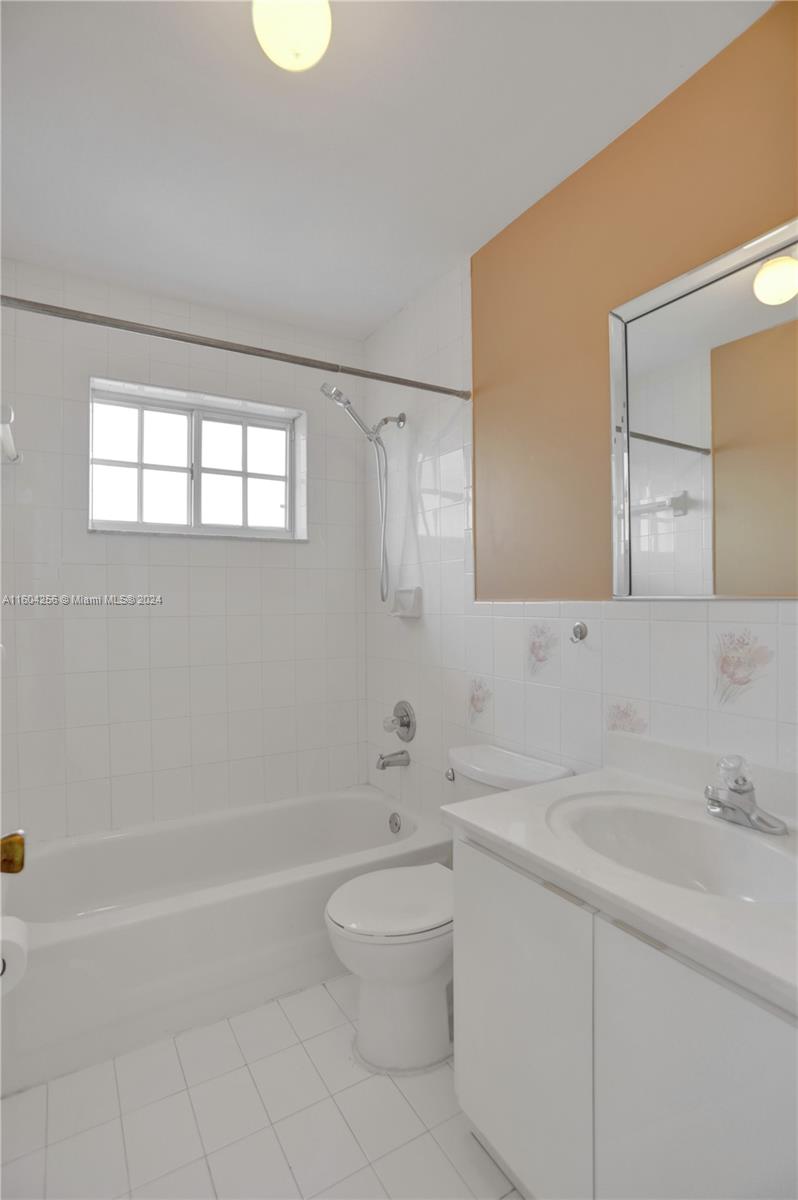 3131 West 79th Place Hialeah, FL 33018 - Photo 25 of 38 a bathroom with a sink a toilet and a bathtub