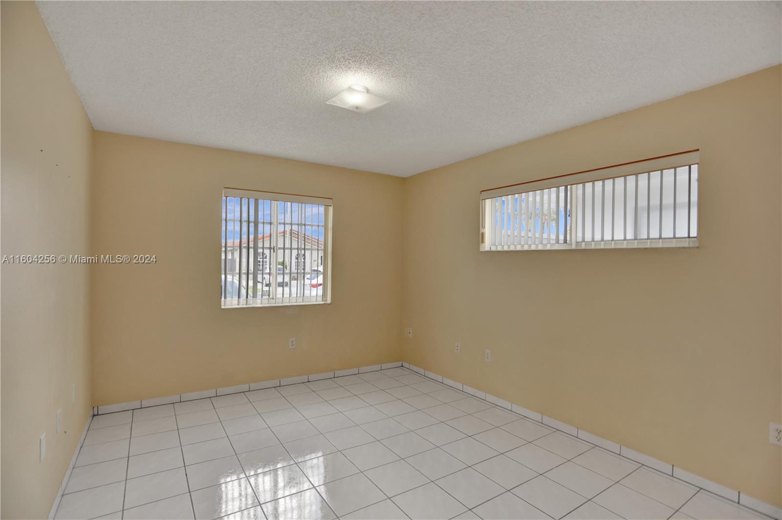 3131 West 79th Place Hialeah, FL 33018 - Photo 26 of 38 a view of an empty room with a window