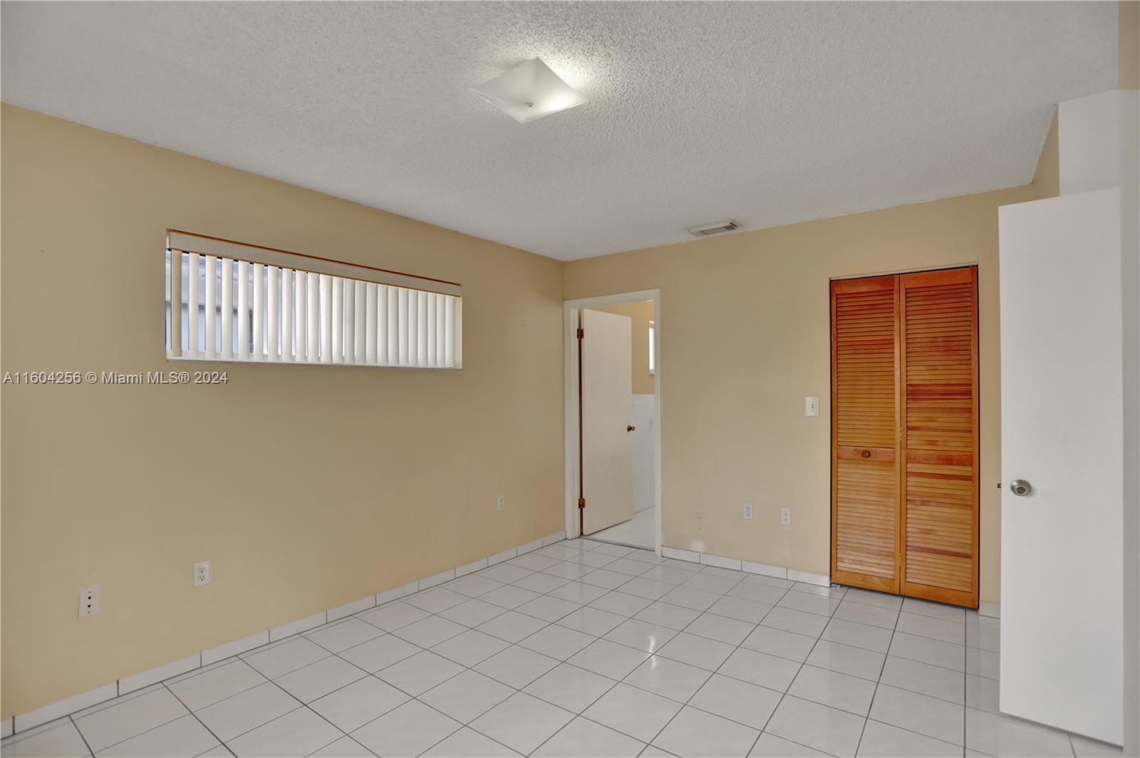 3131 West 79th Place Hialeah, FL 33018 - Photo 27 of 38 a view of an empty room and window