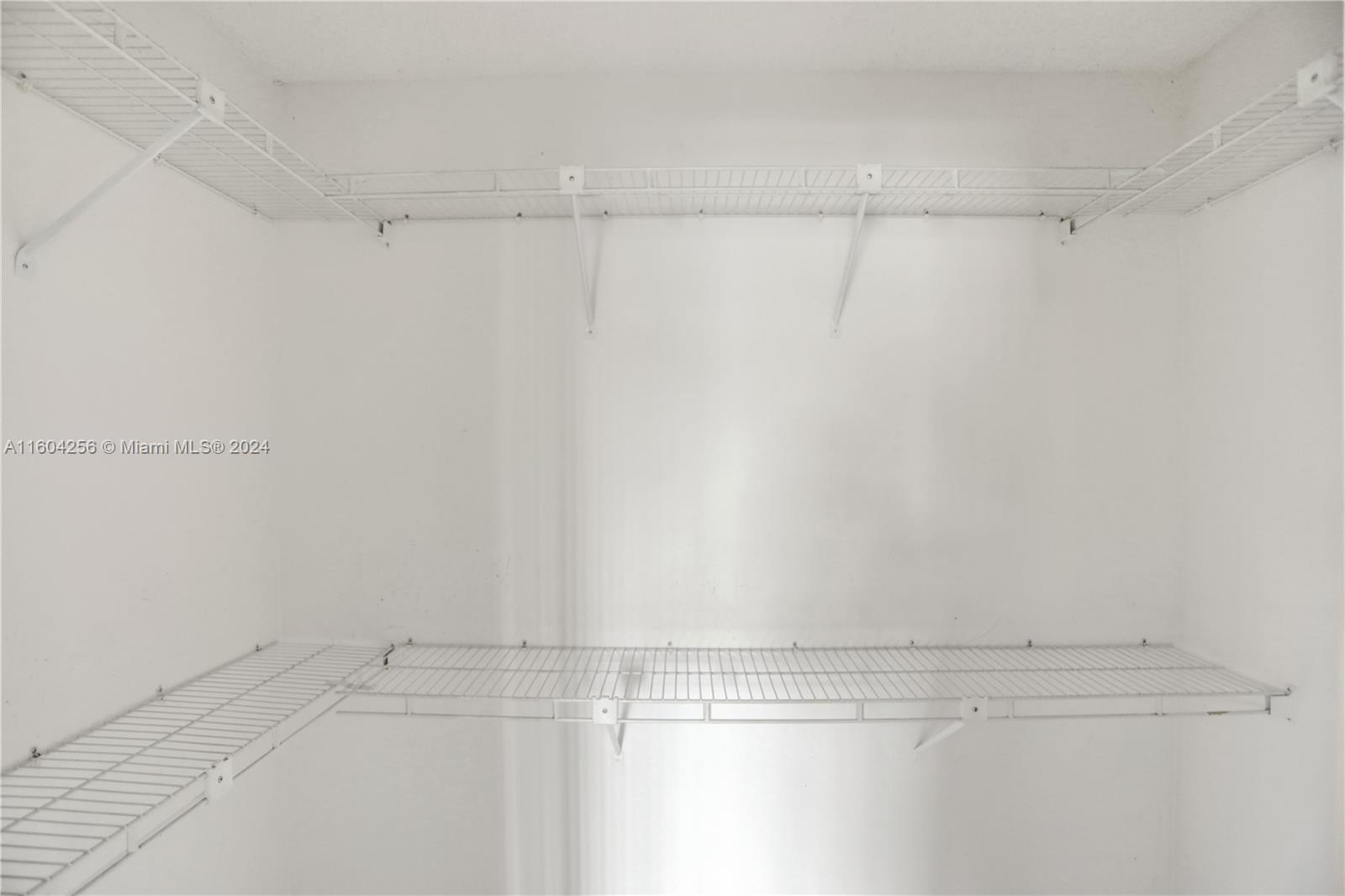 3131 West 79th Place Hialeah, FL 33018 - Photo 32 of 38 a view of a room with racks on the wall