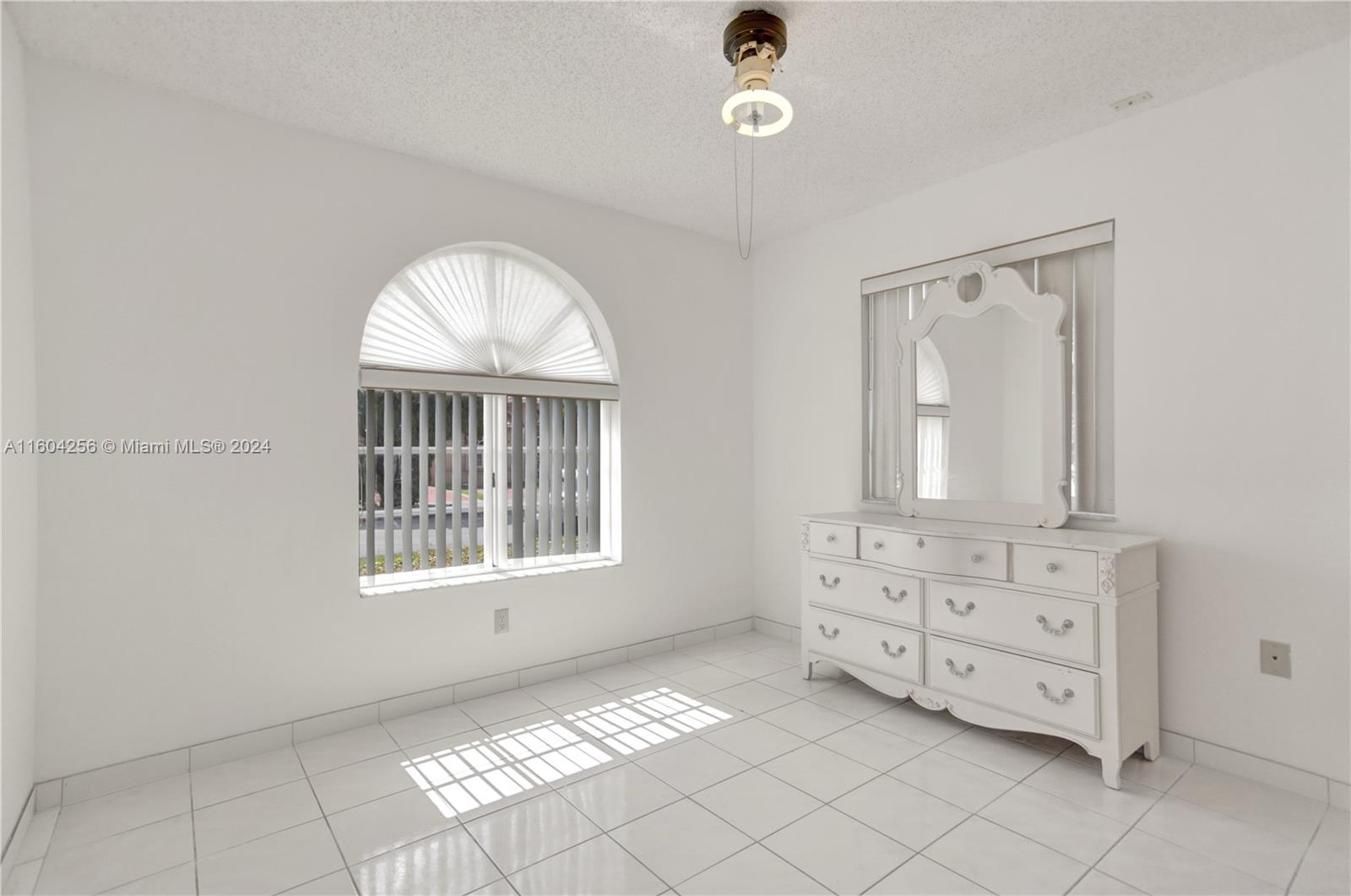 3131 West 79th Place Hialeah, FL 33018 - Photo 33 of 38 an empty room with windows