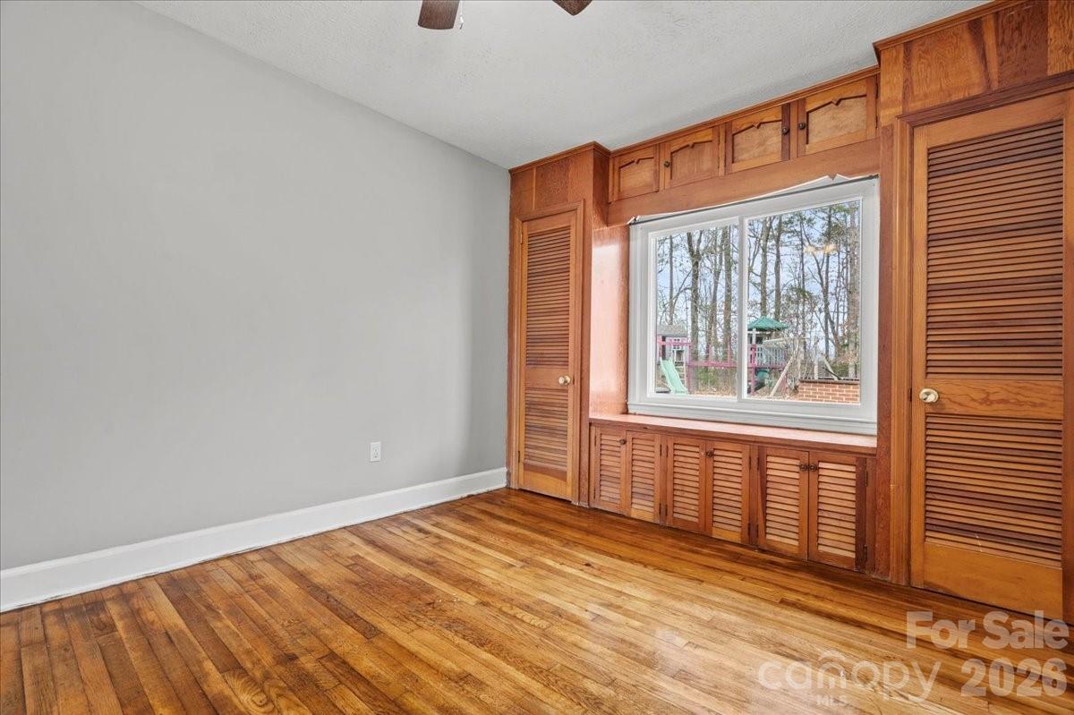2541 Highway 145 Chesterfield, SC 29709 - Photo 15 of 47 an empty room with wooden floor and windows