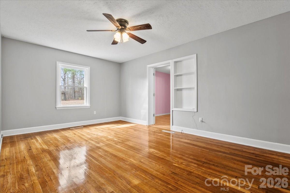 2541 Highway 145 Chesterfield, SC 29709 - Photo 17 of 47 a view of an empty room with window and wooden floor