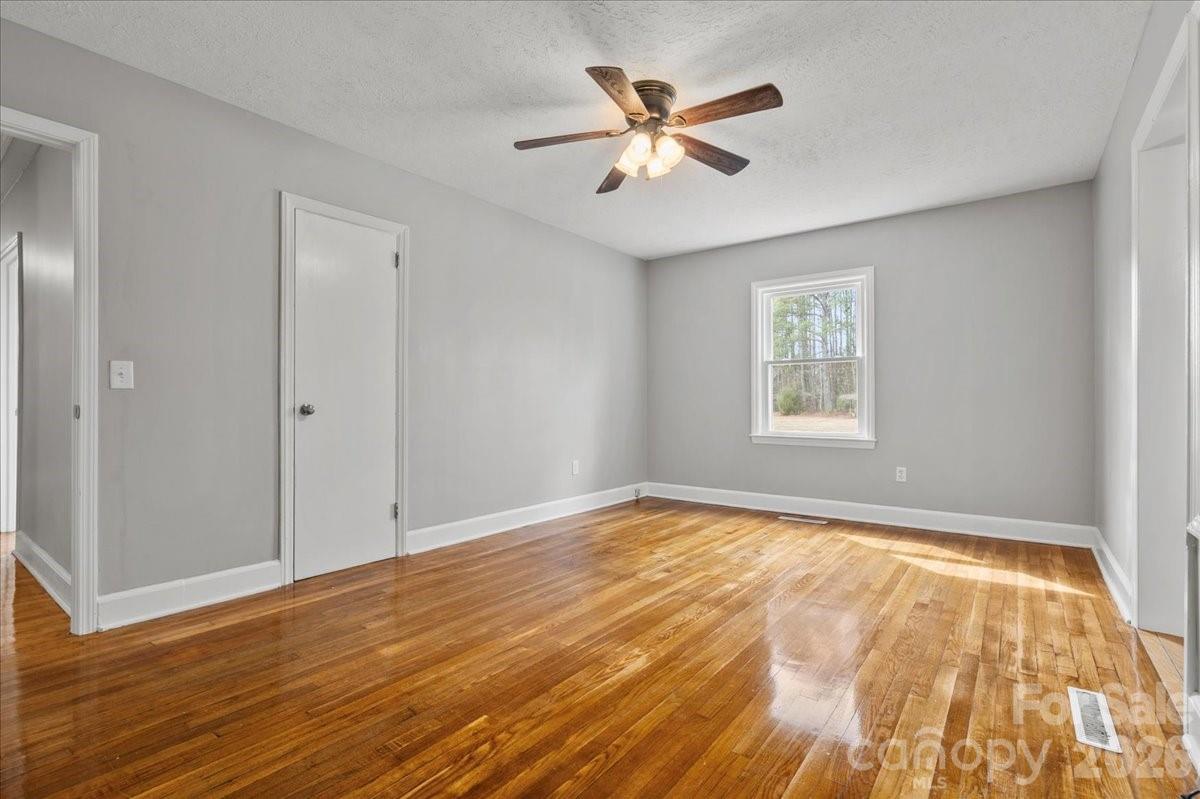2541 Highway 145 Chesterfield, SC 29709 - Photo 18 of 47 a view of an empty room with a window and wooden floor