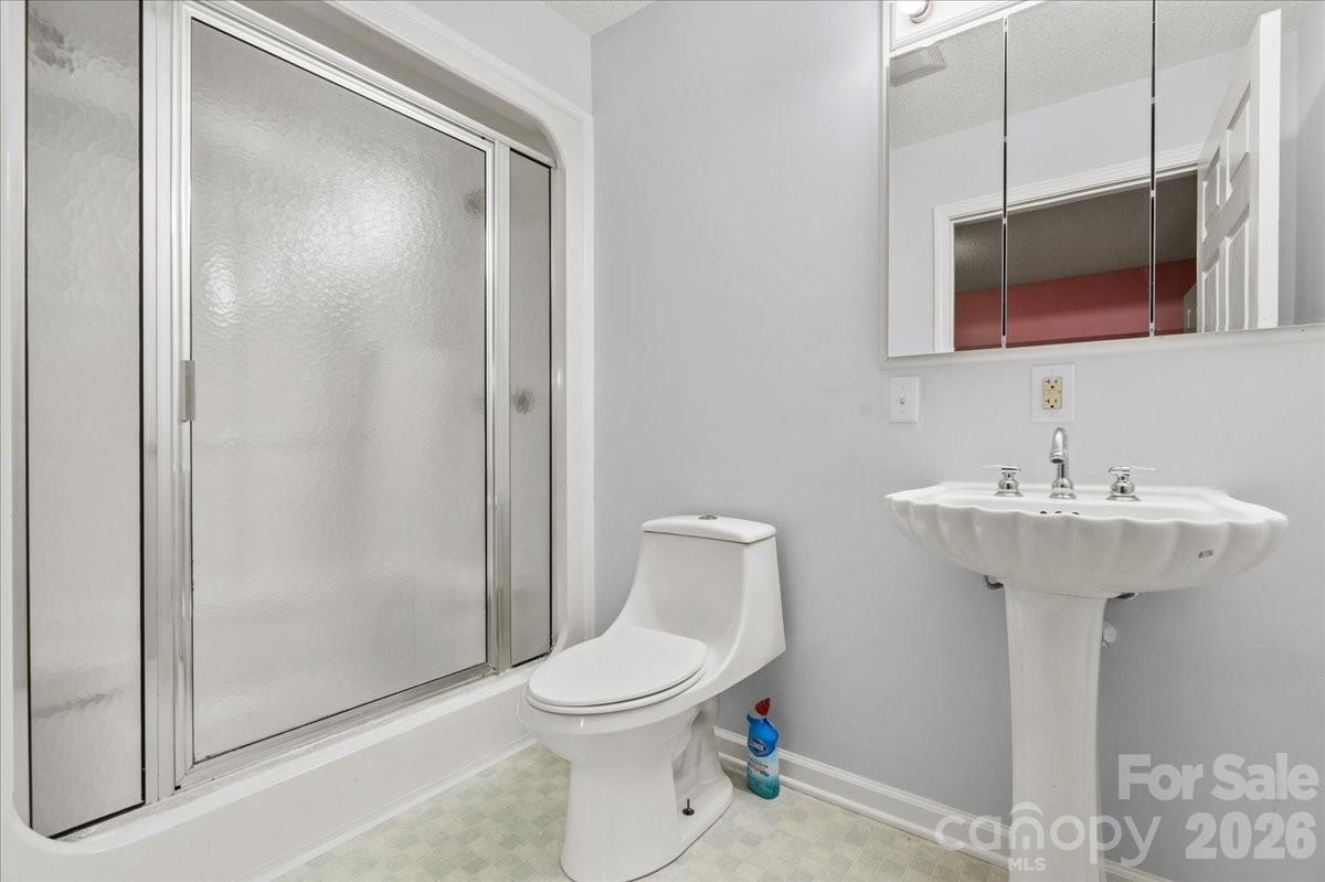 2541 Highway 145 Chesterfield, SC 29709 - Photo 21 of 47 a bathroom with a sink toilet and shower