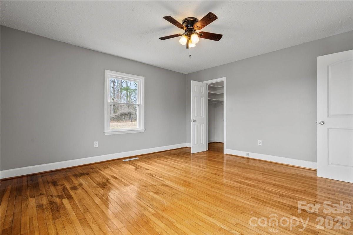 2541 Highway 145 Chesterfield, SC 29709 - Photo 24 of 47 a view of an empty room with a window and a ceiling fan