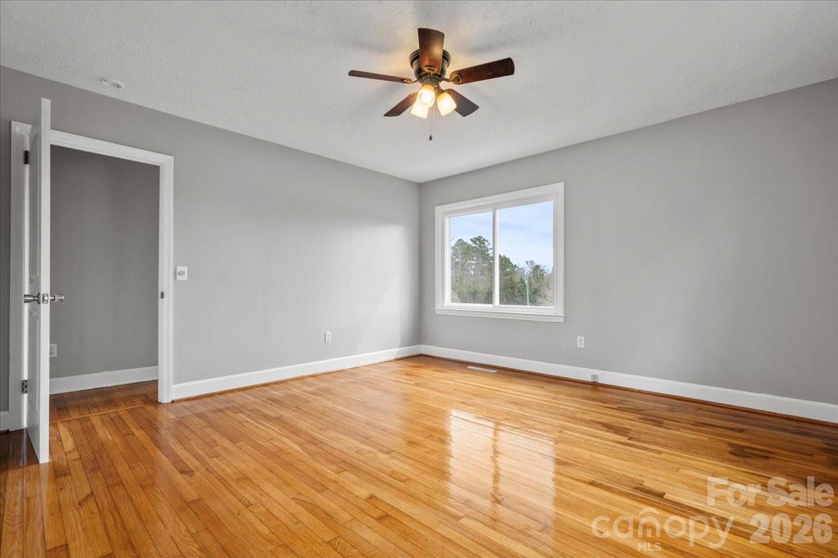 2541 Highway 145 Chesterfield, SC 29709 - Photo 26 of 47 a view of an empty room with window and wooden floor