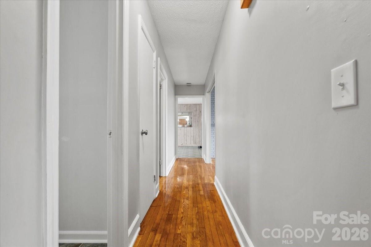 2541 Highway 145 Chesterfield, SC 29709 - Photo 27 of 47 a view of a hallway with wooden floor and staircase