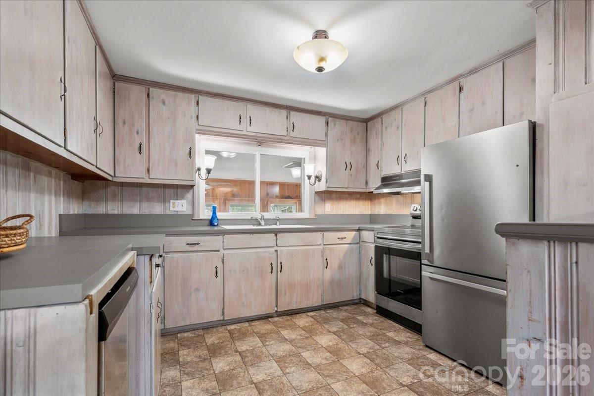 2541 Highway 145 Chesterfield, SC 29709 - Photo 30 of 47 a kitchen with granite countertop stainless steel appliances a refrigerator a sink and cabinets