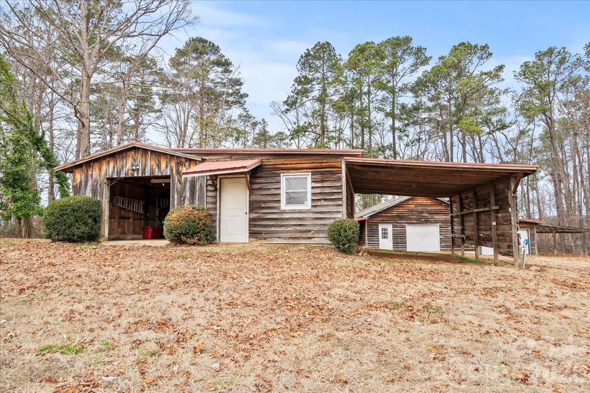 2541 Highway 145 Chesterfield, SC 29709 - Photo 37 of 47 a view of a house with a yard and wooden fence