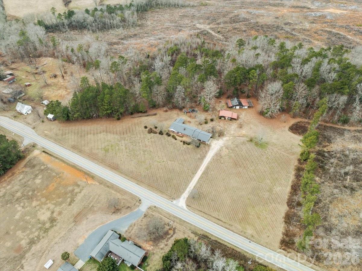 2541 Highway 145 Chesterfield, SC 29709 - Photo 4 of 47 a view of a dry yard with wooden fence