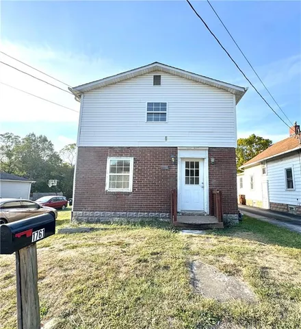 a front view of house with yard