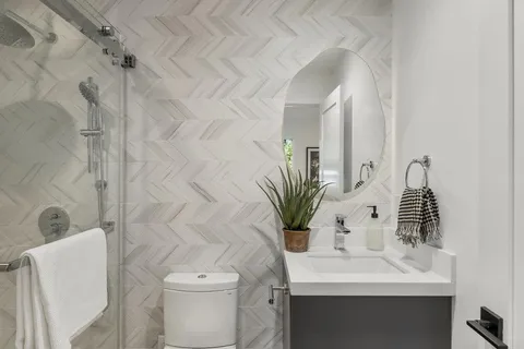 a bathroom with a sink a toilet and tub