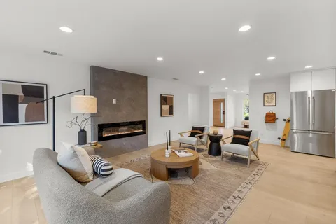 a living room with furniture and a table