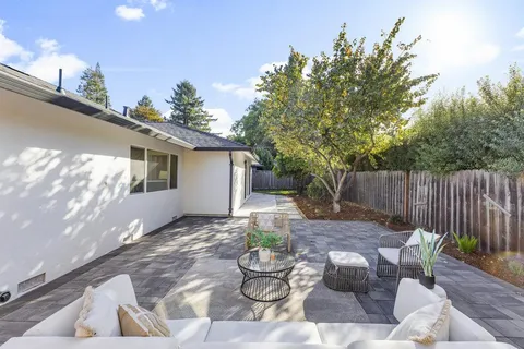 a view of a backyard with furniture