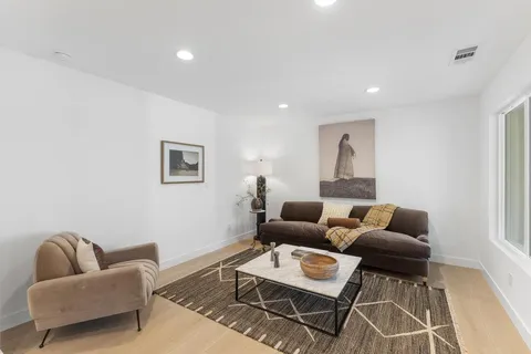 a living room with furniture and a couch