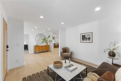 a living room with furniture and a table