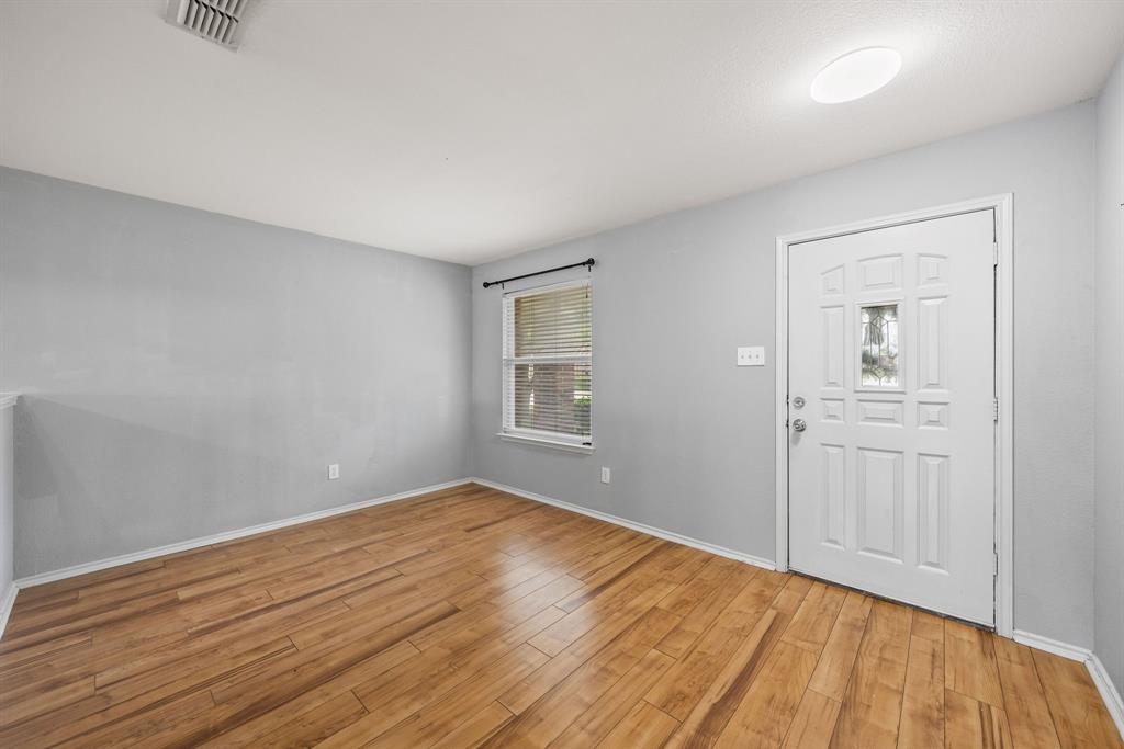 601 Amy Way Euless, TX 76039 - Photo 7 of 40 a view of an empty room with wooden floor