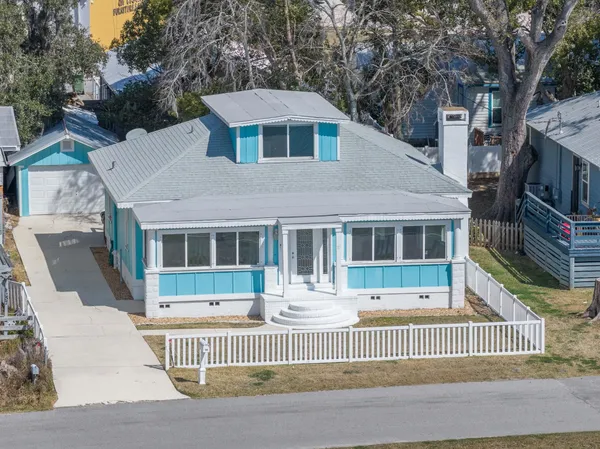 a front view of a house with a lake view