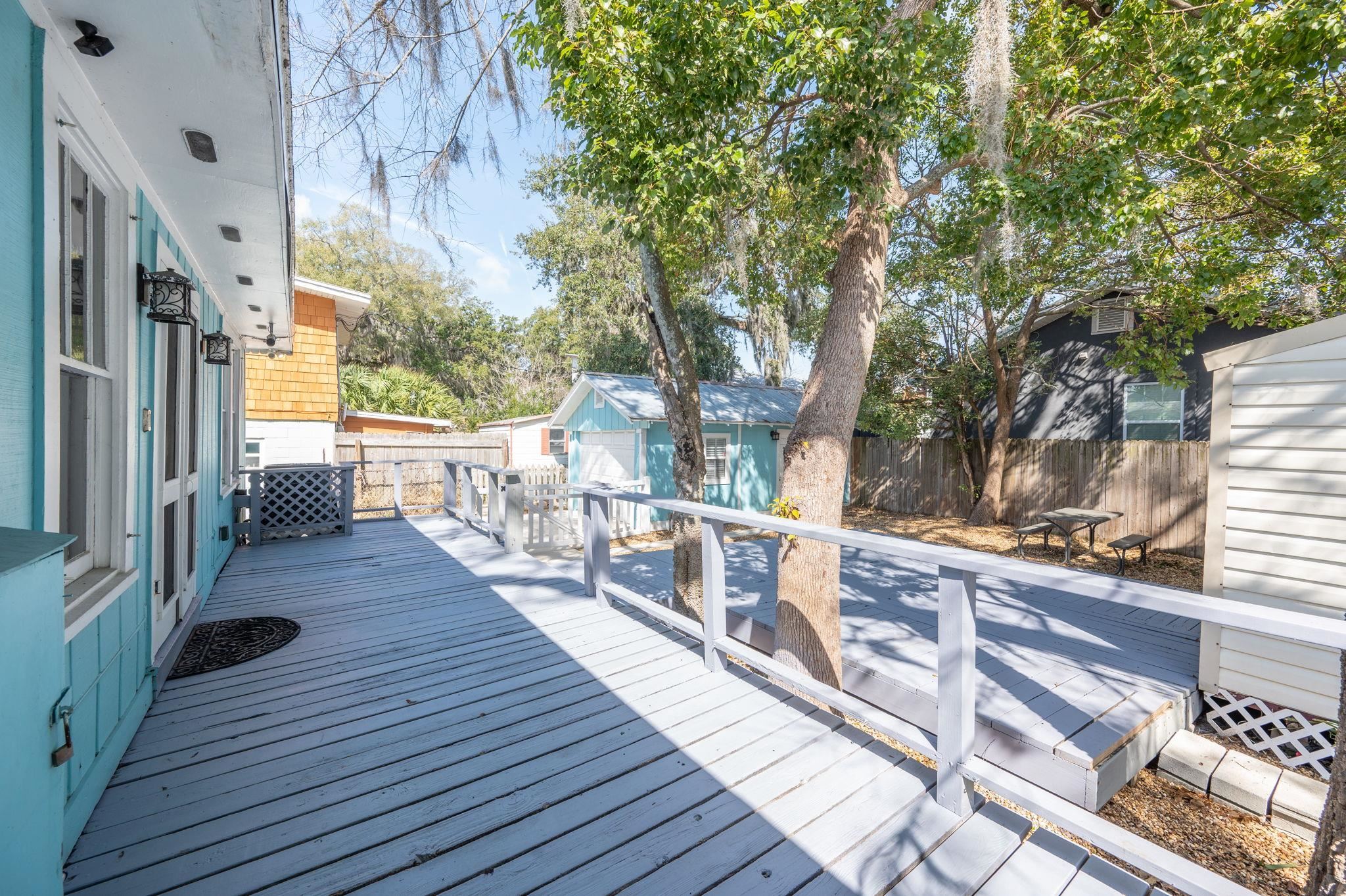 59 Lewis Boulevard St. Augustine, FL 32084 - Photo 29 of 75 Wooden deck with an outbuilding and a fenced backyard