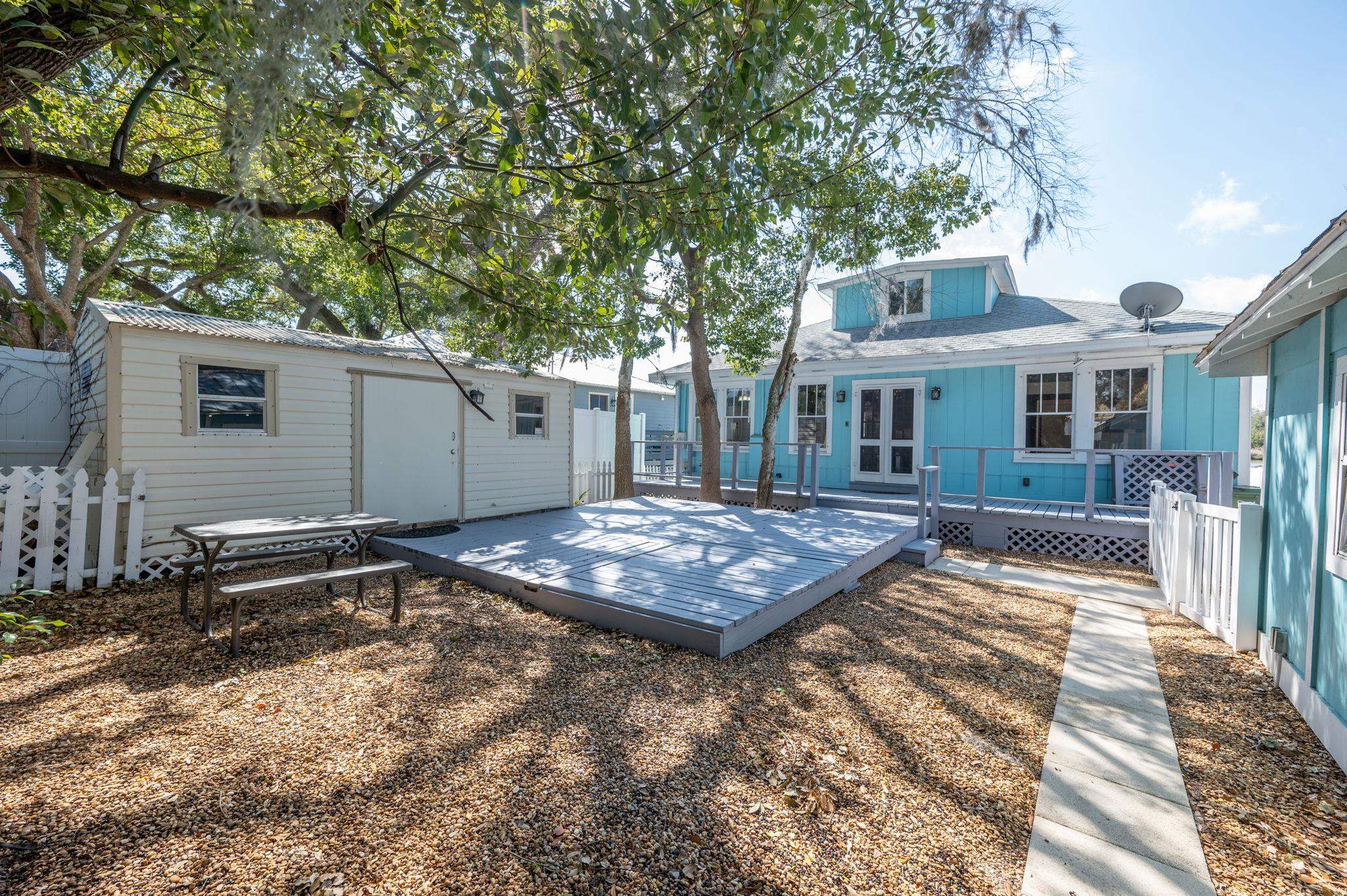 59 Lewis Boulevard St. Augustine, FL 32084 - Photo 31 of 75 Rear view of home featuring a deck, an outdoor structure, and french doors