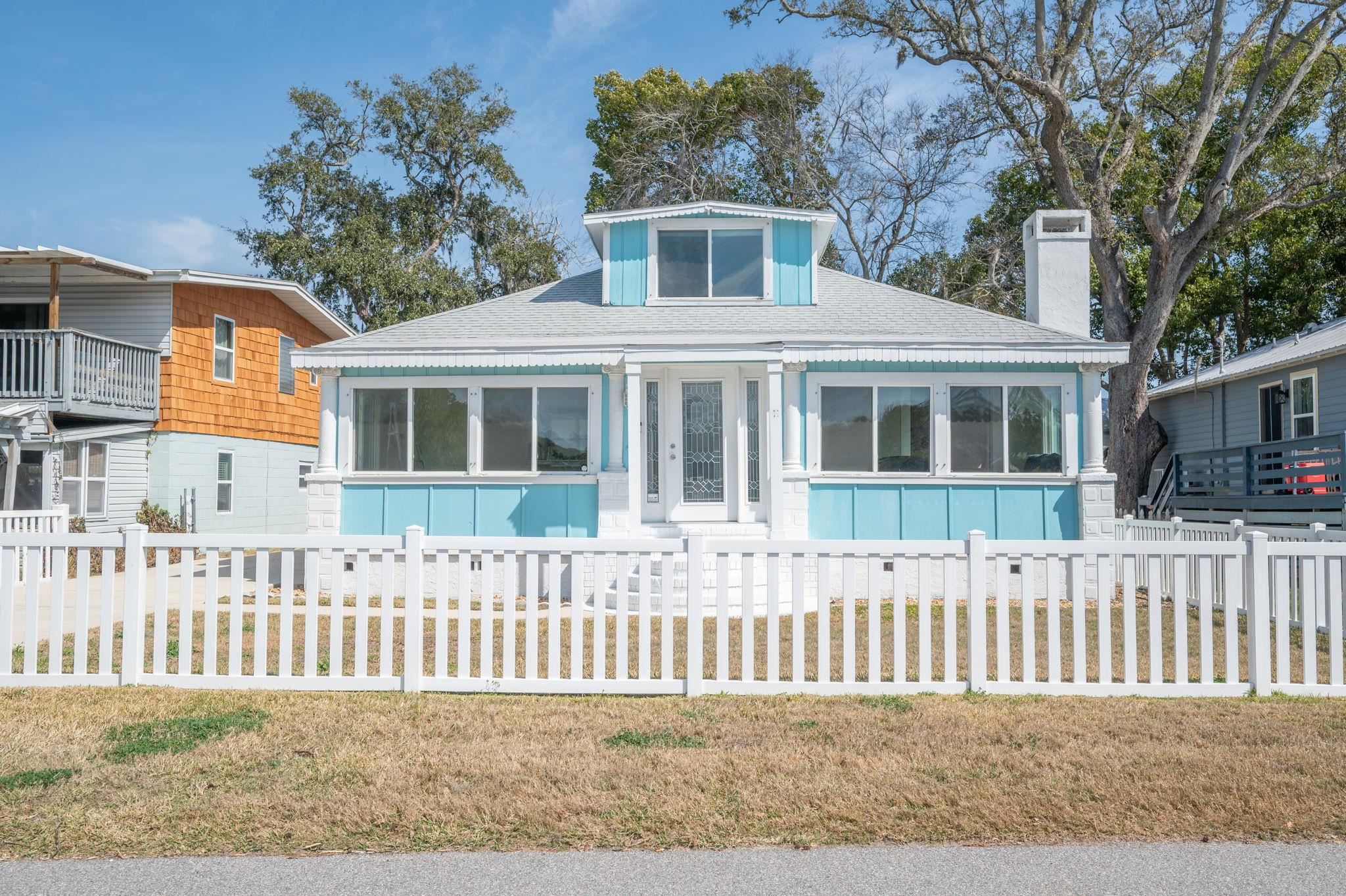 59 Lewis Boulevard St. Augustine, FL 32084 - Photo 56 of 75 Bungalow-style home with a fenced front yard, a chimney, and roof with shingles