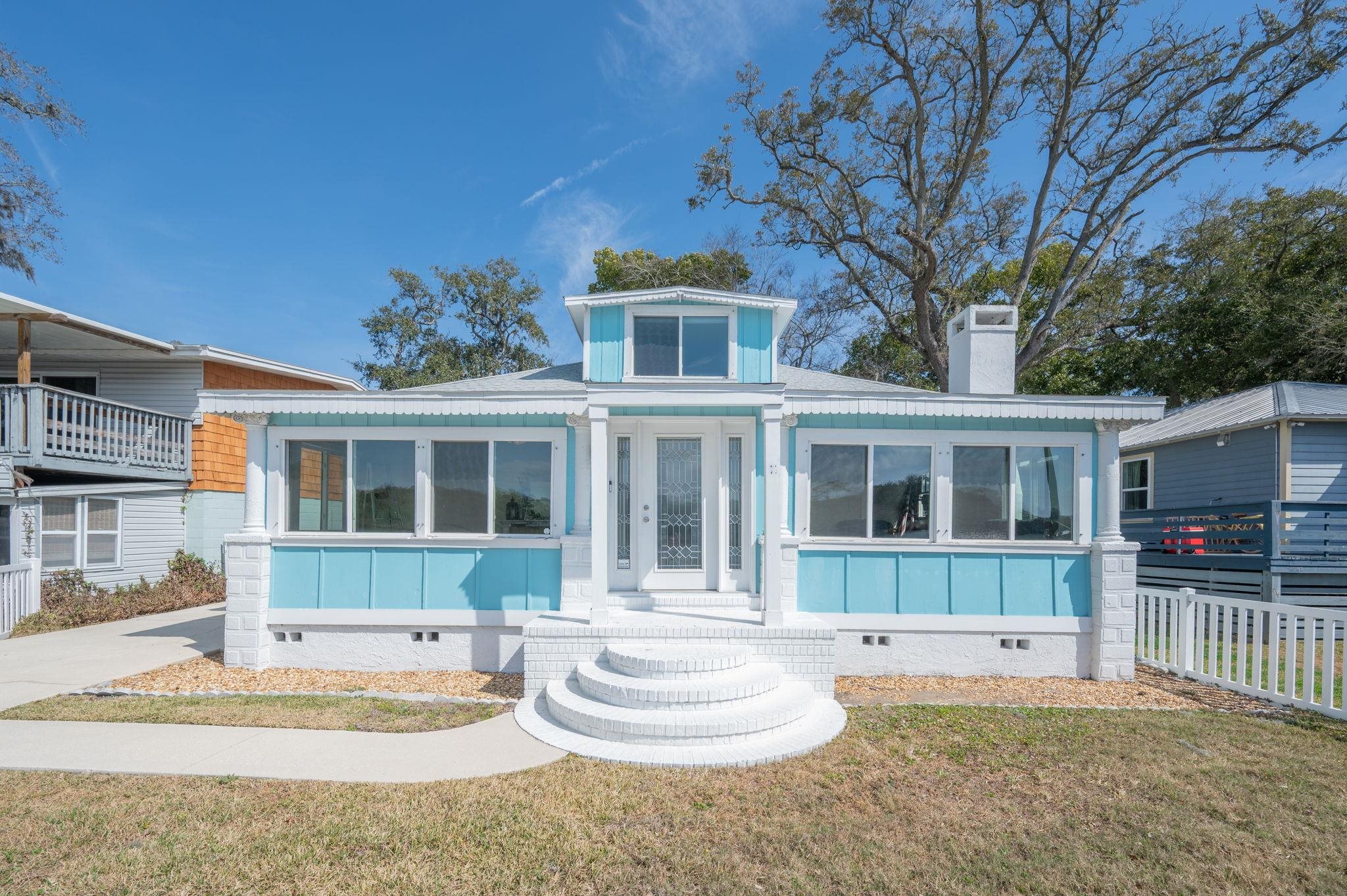 59 Lewis Boulevard St. Augustine, FL 32084 - Photo 57 of 75 View of front of house with crawl space, a front lawn, and a chimney