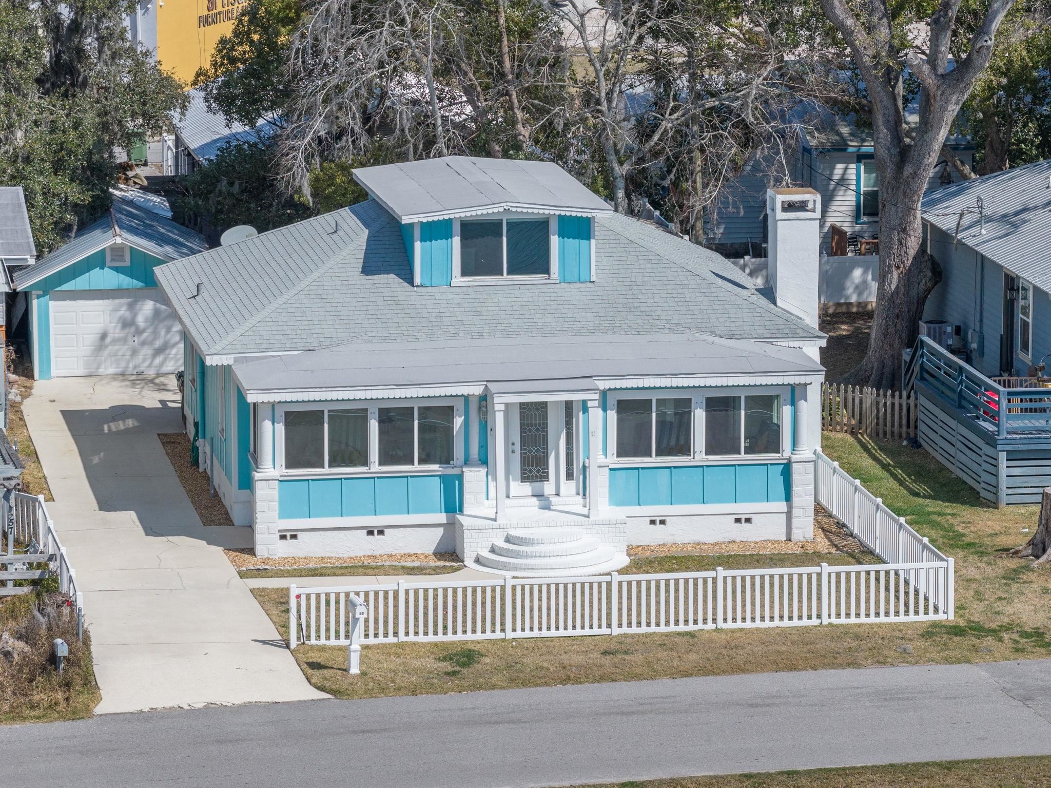 59 Lewis Boulevard St. Augustine, FL 32084 - Photo 6 of 75 Bungalow-style home with crawl space, a fenced front yard, and a sunroom