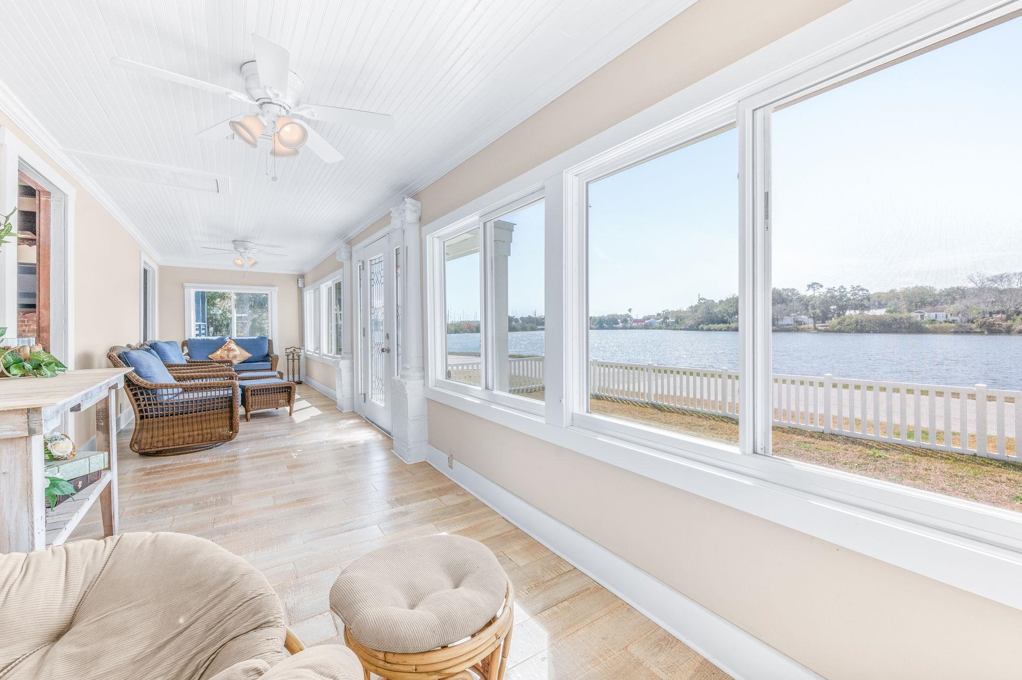 59 Lewis Boulevard St. Augustine, FL 32084 - Photo 64 of 75 Sunroom / solarium featuring wood finished floors, a water view, and ornamental molding