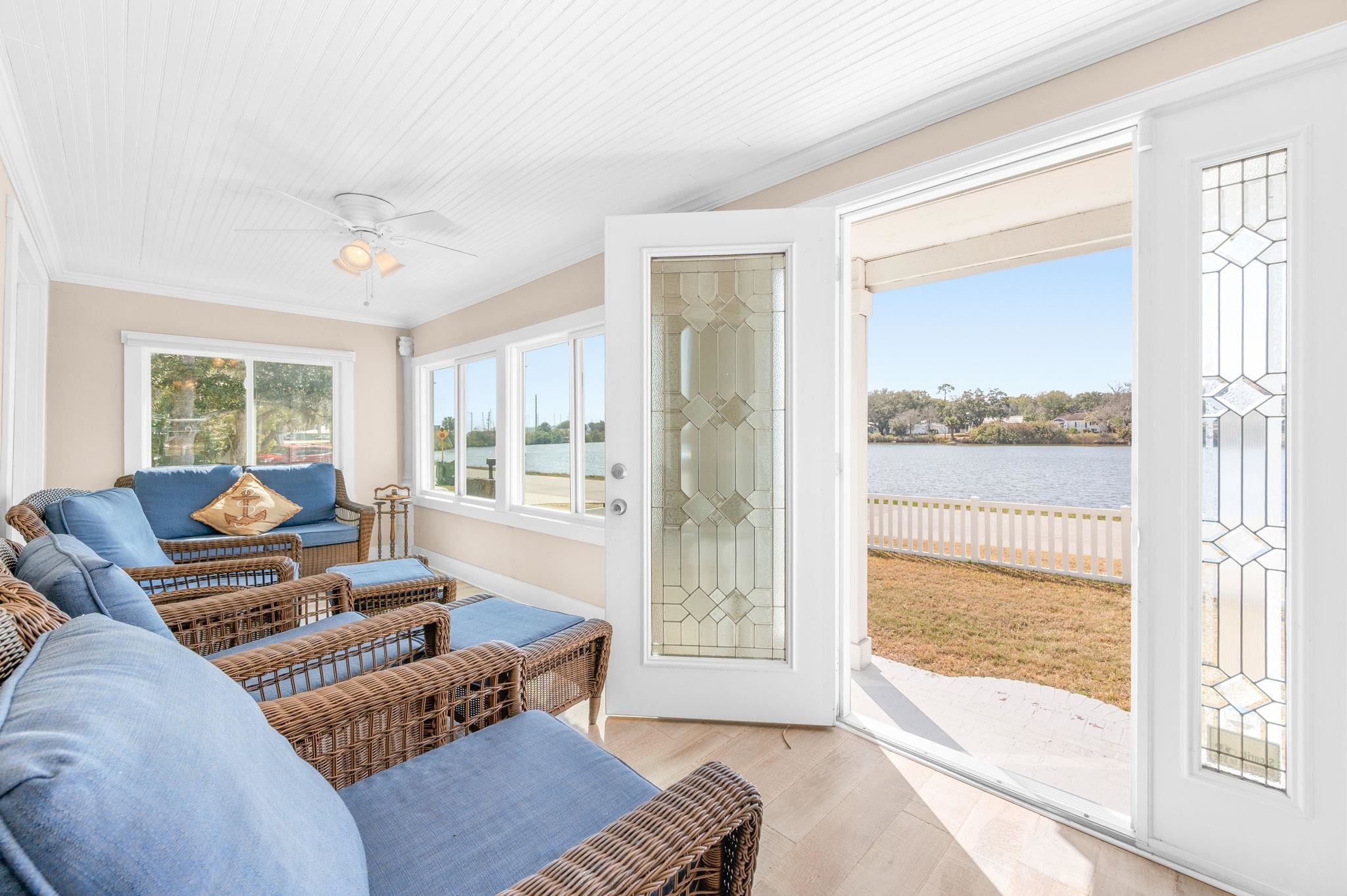 59 Lewis Boulevard St. Augustine, FL 32084 - Photo 65 of 75 Sunroom / solarium featuring wood finished floors, a water view, and crown molding