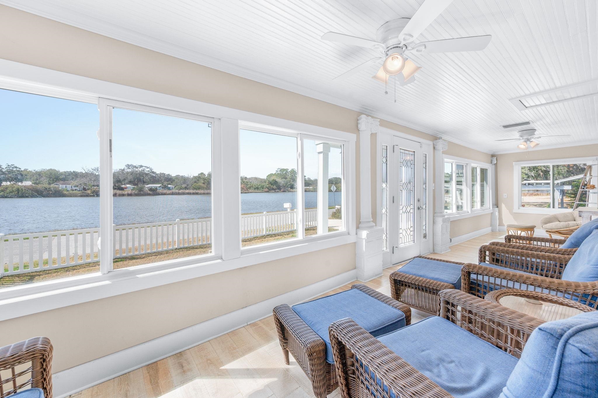 59 Lewis Boulevard St. Augustine, FL 32084 - Photo 66 of 75 Sunroom / solarium featuring wood finished floors, a water view, and ornamental molding
