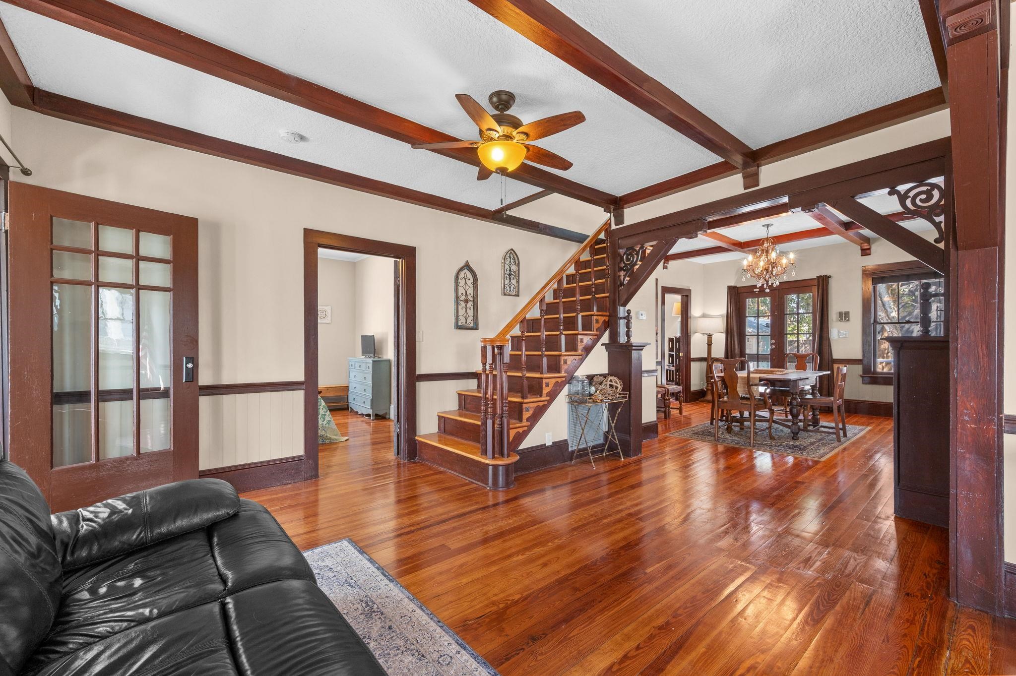 59 Lewis Boulevard St. Augustine, FL 32084 - Photo 8 of 75 Living area featuring hardwood / wood-style floors, a chandelier, beamed ceiling, and a ceiling fan