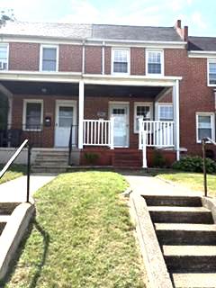 7007 Bank Street Baltimore, MD 21224 - Photo 17 of 17 a view of a house with more chairs and wooden fence