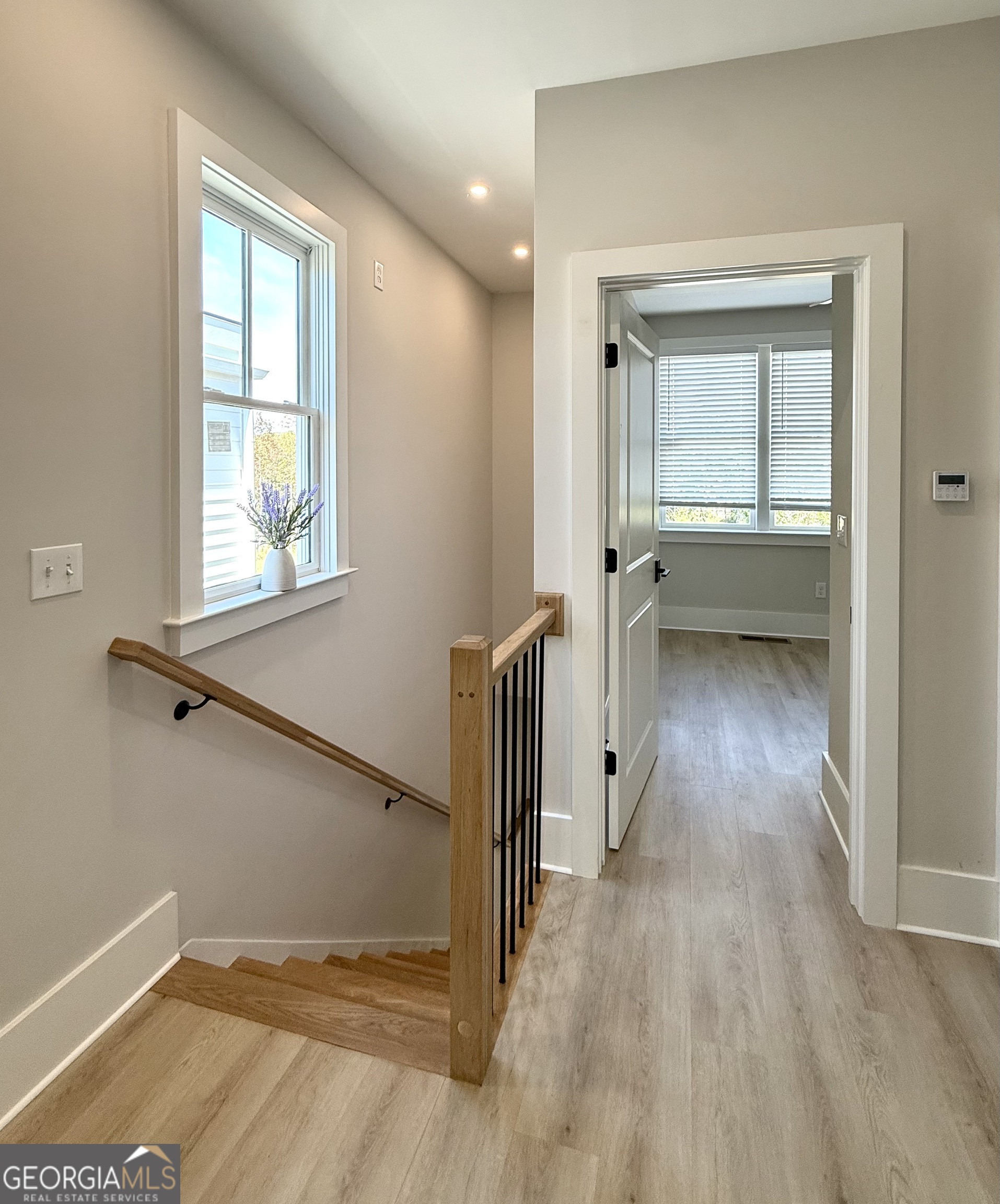 1 East Jarrard Street Cleveland, GA 30528 - Photo 13 of 23 a view of hallway with a large window and wooden floor