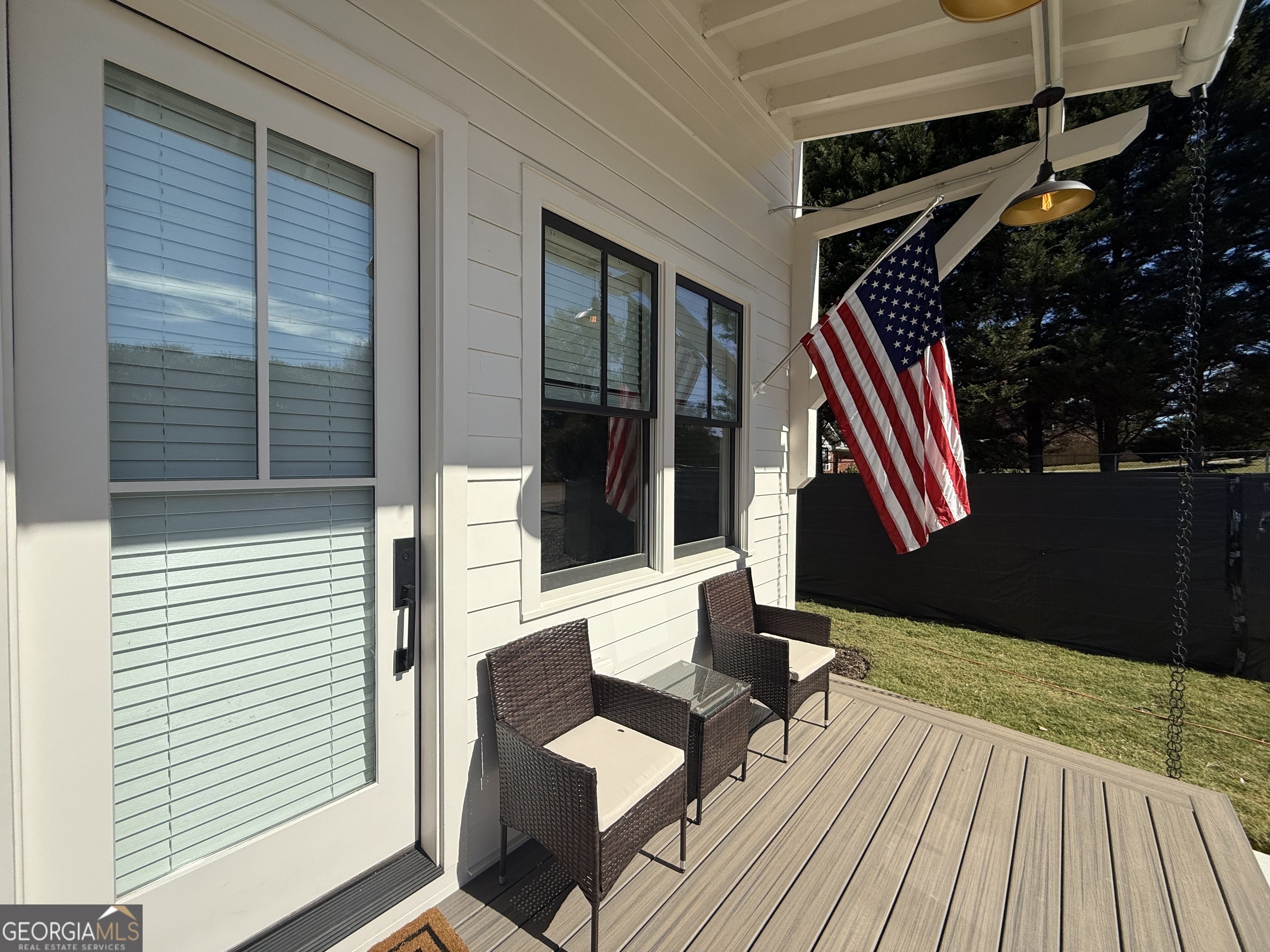 1 East Jarrard Street Cleveland, GA 30528 - Photo 2 of 23 a view of a patio with table and chairs and wooden floor