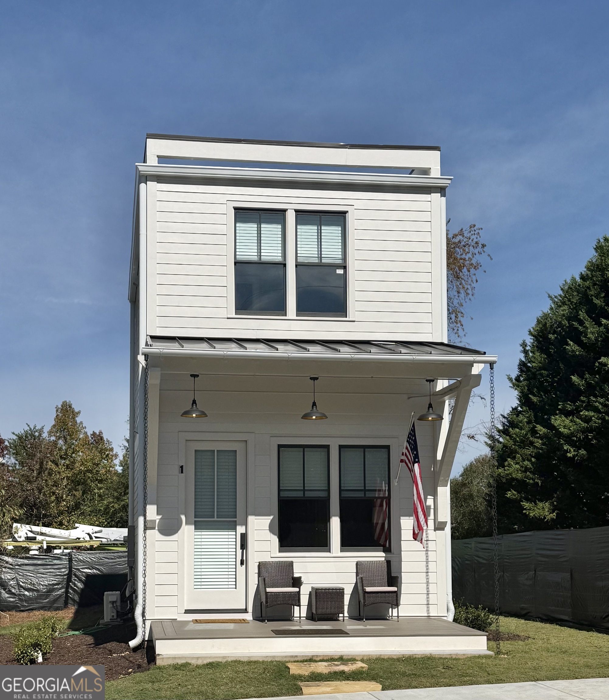 1 East Jarrard Street Cleveland, GA 30528 - Photo 3 of 23 a view of a house with a large window and yard