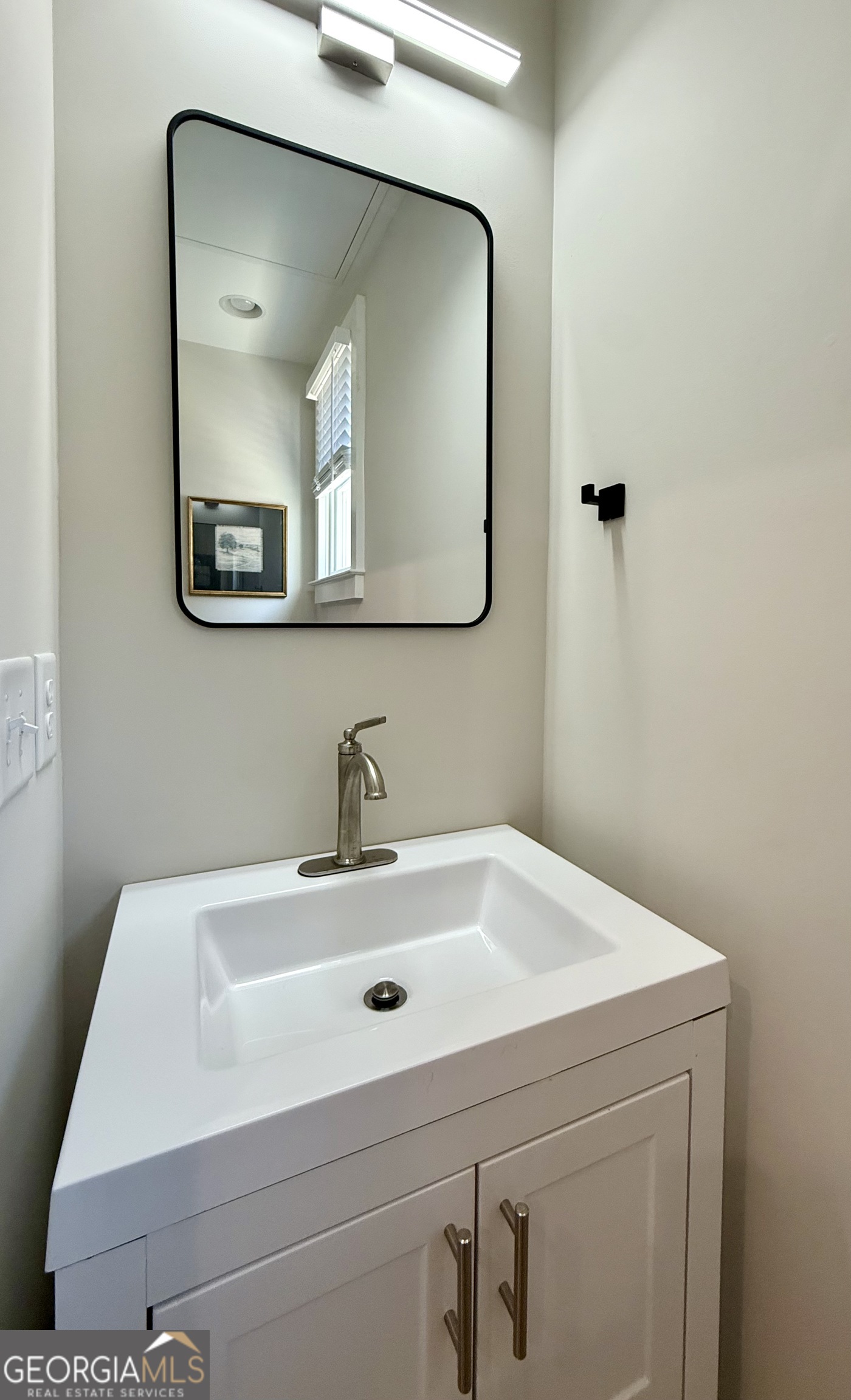 1 East Jarrard Street Cleveland, GA 30528 - Photo 9 of 23 a bathroom with a sink and a mirror