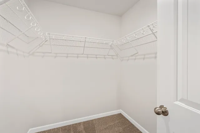 a view of a room with white walls