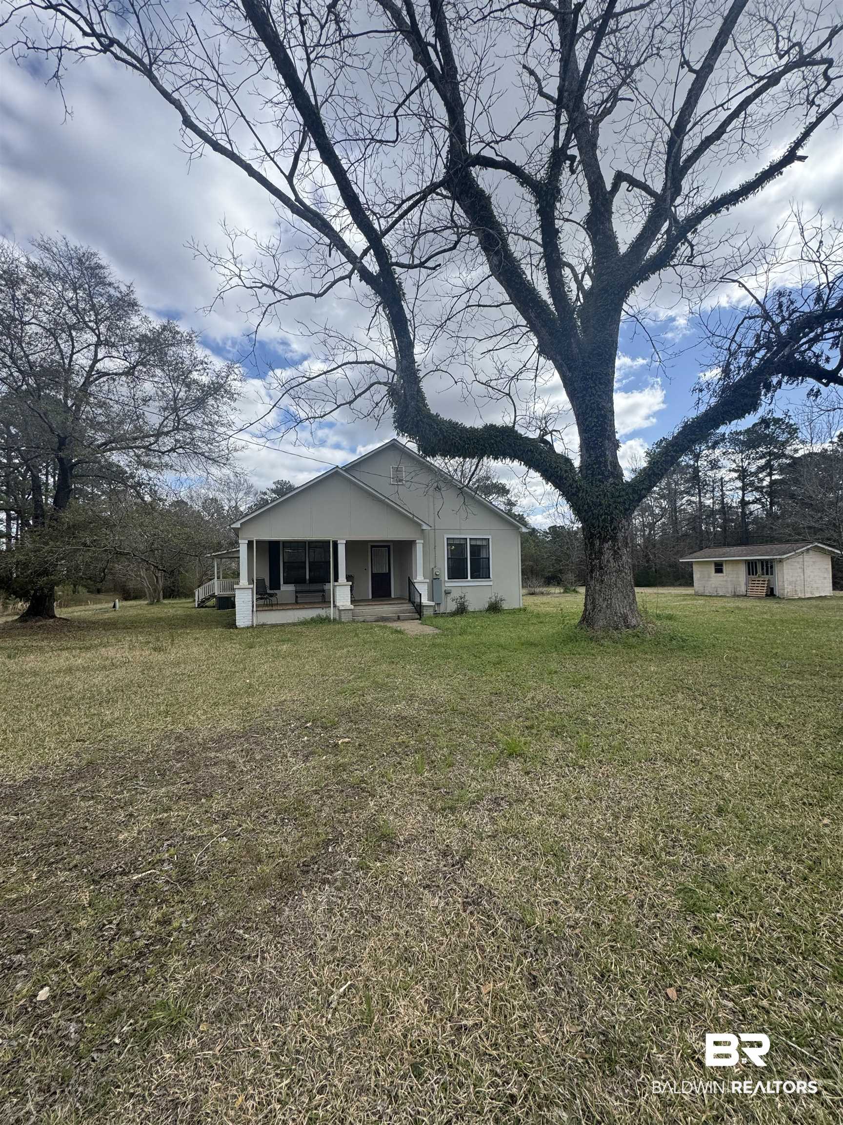 275 Thames Road Frisco City, AL 36445 - Photo 1 of 24 Front view of house featuring a porch and a yard