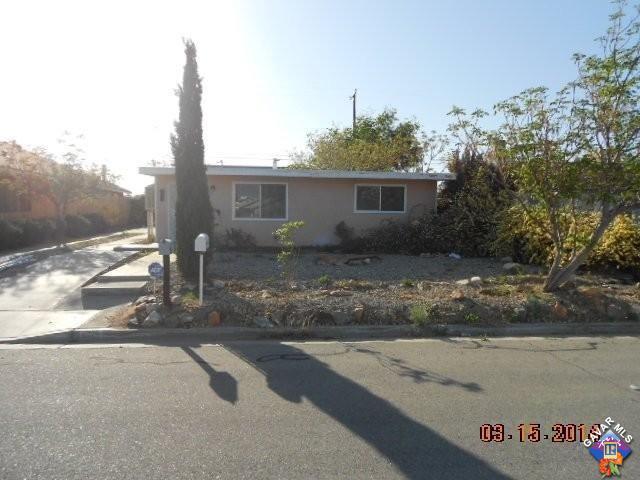 1233 South McCall Street Ridgecrest, CA 93555 - Photo 1 of 8 a view of a house with a backyard