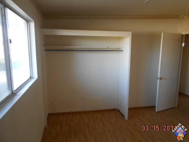 1233 South McCall Street Ridgecrest, CA 93555 - Photo 4 of 8 a view of a room with wooden floor and a window
